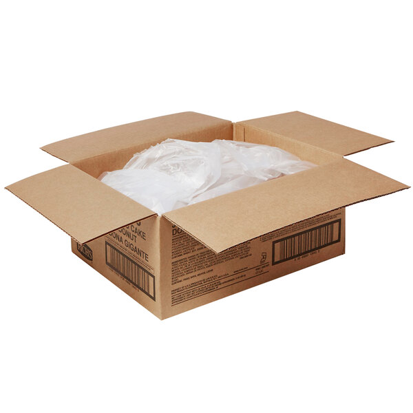 A cardboard box with plastic bags inside containing Rich's Ready-To-Finish Jumbo Plain Cake Donut Rings.