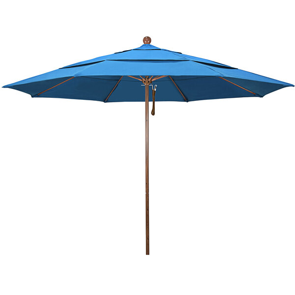 A cyan California Umbrella with a wooden pole.