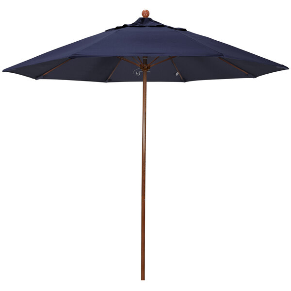 A California Umbrella with a navy blue Sunbrella canopy and an American Oak pole.