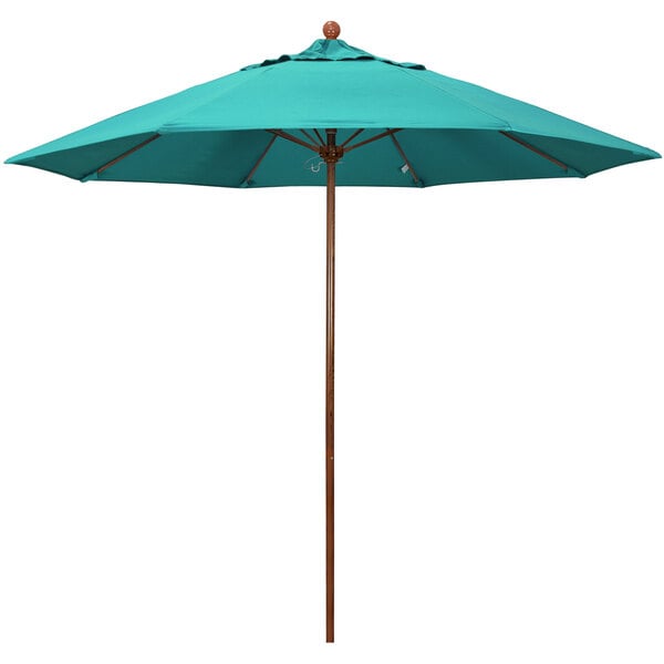 A teal California Umbrella with a wooden pole and an Aruba Sunbrella canopy.