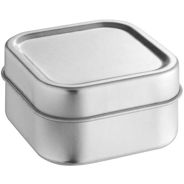 A silver square tin with a slip cover.