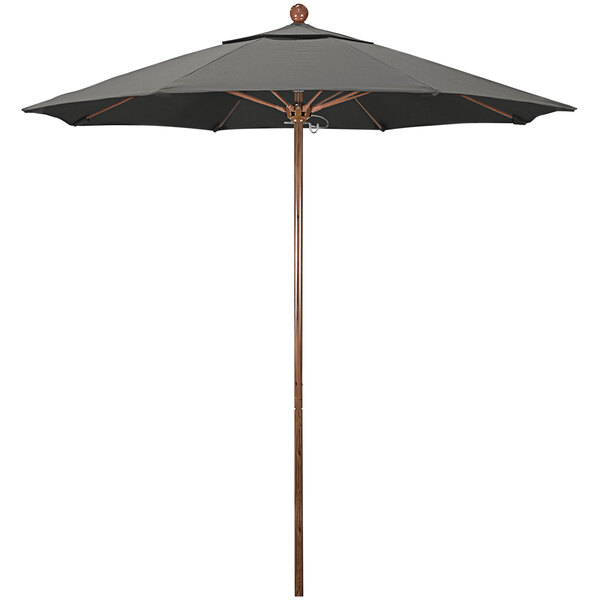 A close-up of a black California Umbrella with an American Oak pole.