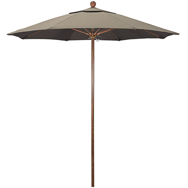 A California Umbrella with a taupe Sunbrella canopy on a wooden pole.