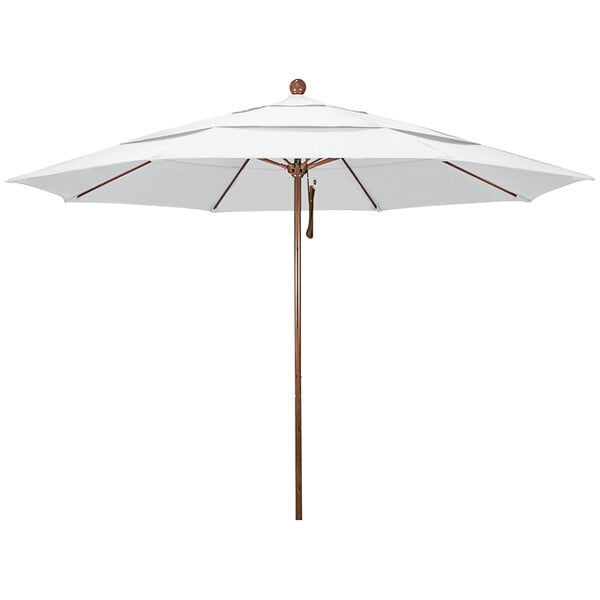 A white California Umbrella with a wooden pole.