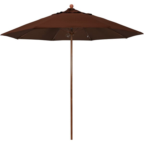 A California Umbrella brown umbrella with a wooden pole.