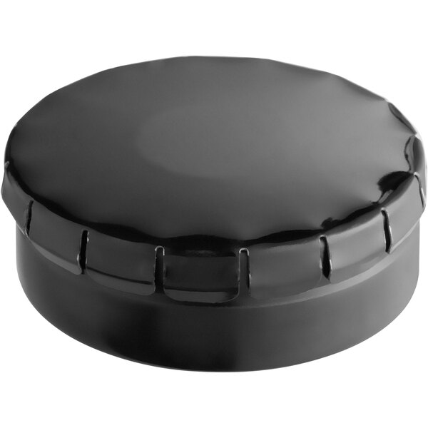 A black round metal tin with a push and pop cover.