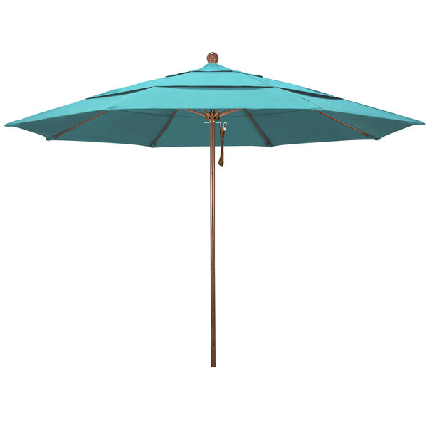 A close up of a blue California Umbrella with a wooden pole.