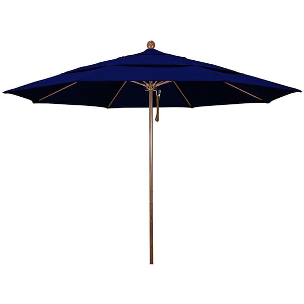 A California Umbrella blue Sunbrella canopy with a wooden pole.