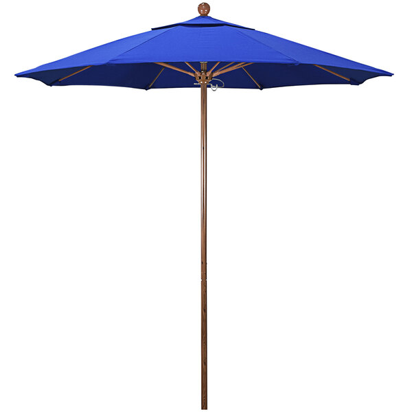 A California Umbrella blue umbrella with a wooden pole.