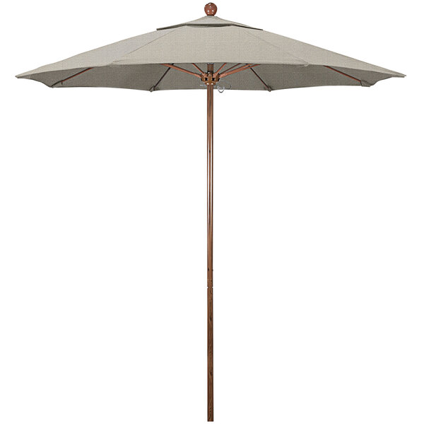 A California Umbrella Venture Series outdoor umbrella with a woven granite canopy on a wooden pole.
