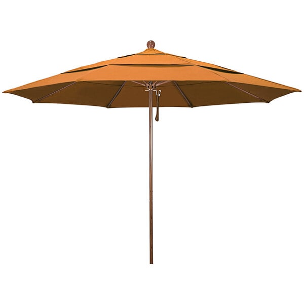 A close-up of a California Umbrella with an orange canopy and wooden pole.
