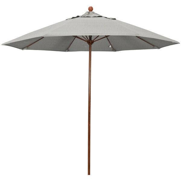 A California Umbrella Venture Series outdoor umbrella with a Sunbrella granite grey canopy and American oak pole.