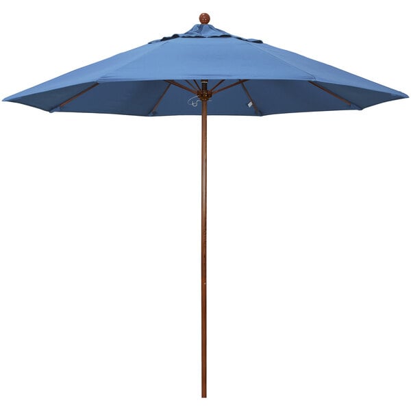 A blue California Umbrella with a wooden pole.