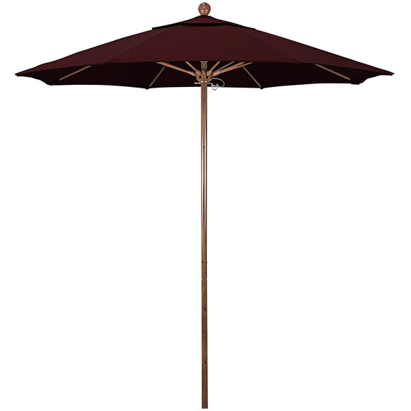 A close-up of a California Umbrella with a burgundy canopy and American Oak pole.