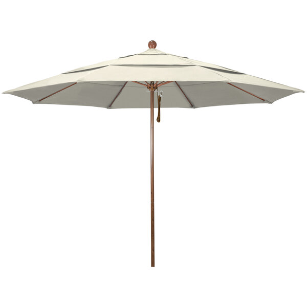 A white umbrella with a wooden pole.