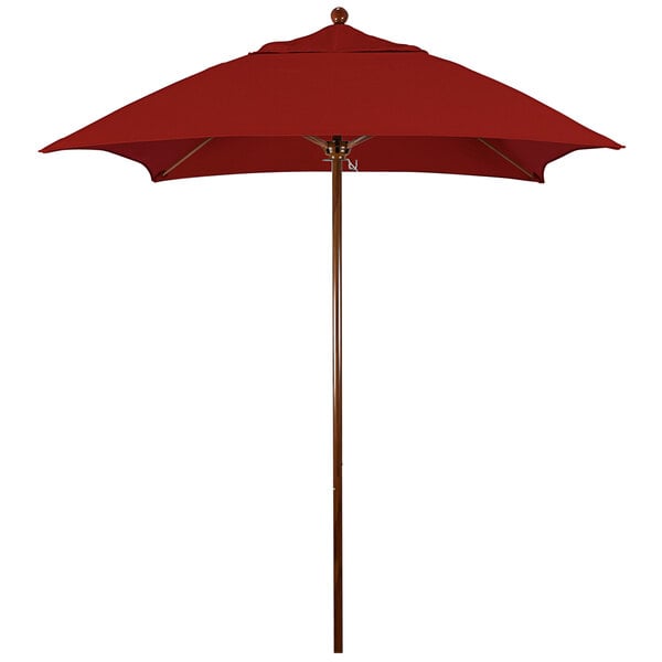 A red California Umbrella with a wooden pole.