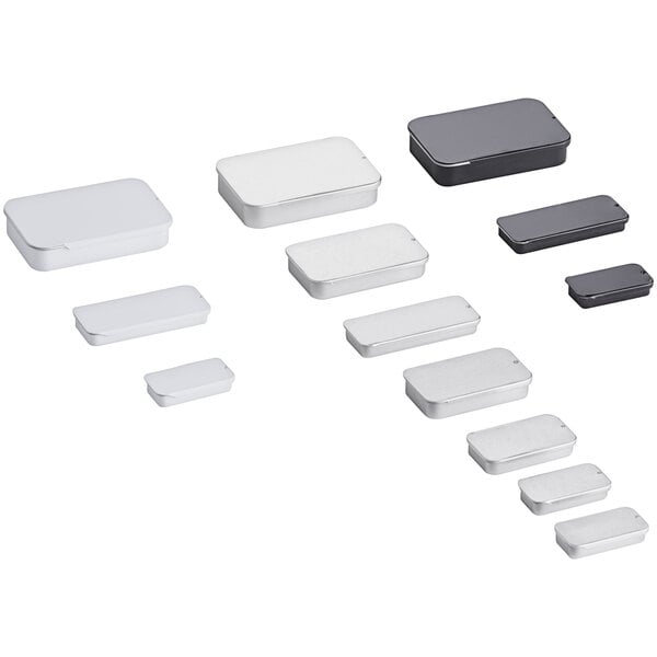 A group of 192 rectangular silver metal tins with slide tops on a white surface.