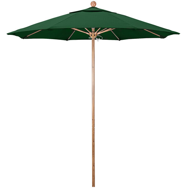 A green California Umbrella with a wooden pole.