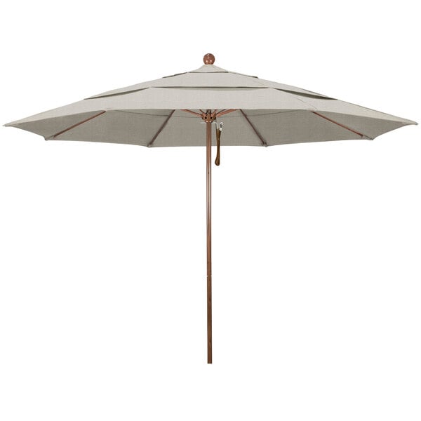 A large umbrella with a brown wooden pole and a beige shade.