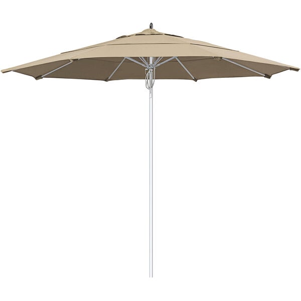 A tan California Umbrella with a silver pole.