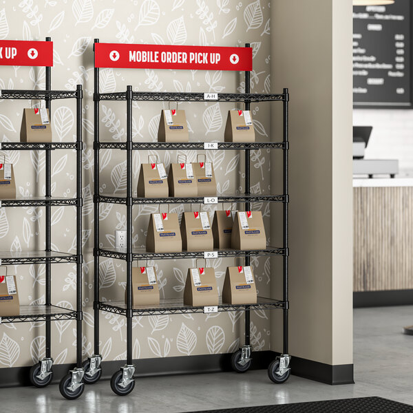 A Regency black epoxy shelving station with PVC shelf mats holding boxes.