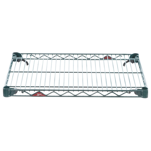 A Metroseal 3 wire shelf with white bars on a metal rack.