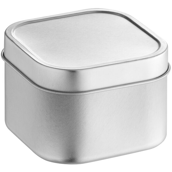 A silver square tin with a slip cover.