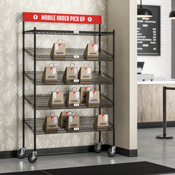 A mobile take-out cart with Regency black epoxy shelving and slanted drop-in baskets.