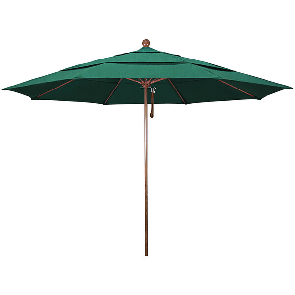 A California Umbrella Venture Series green Sunbrella umbrella with a wooden pole.