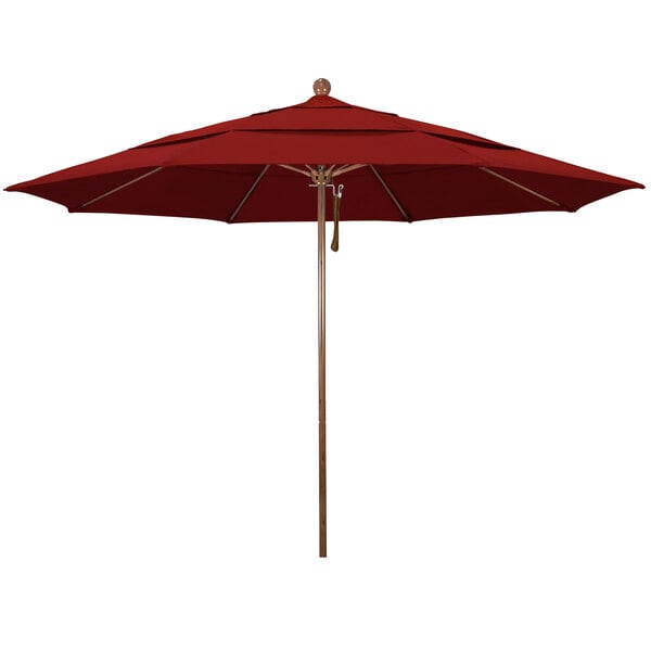 A close-up of a red California Umbrella with a wooden pole.