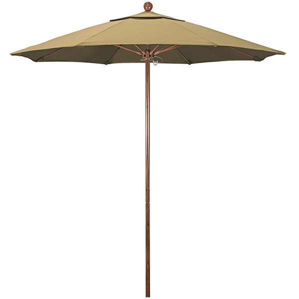 A California Umbrella with a champagne fabric shade on a wooden pole.