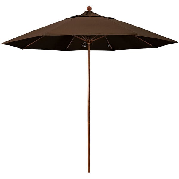 A close-up of a brown California Umbrella with a wooden pole.