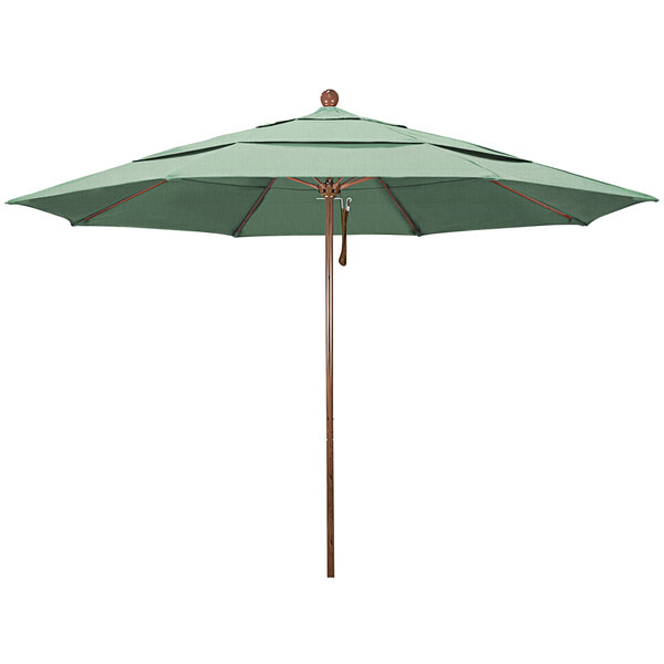 A green umbrella with a wooden pole.