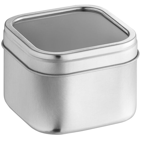 A silver square tin with a clear window lid.