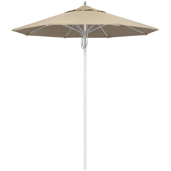 A beige California Umbrella with a silver pole.