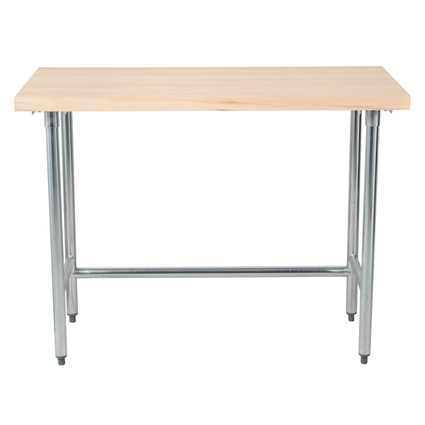 An Advance Tabco wood work table with a galvanized metal base.
