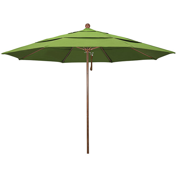 A green California Umbrella with a wooden pole.