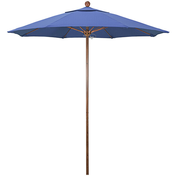 A blue California Umbrella with a wooden pole.