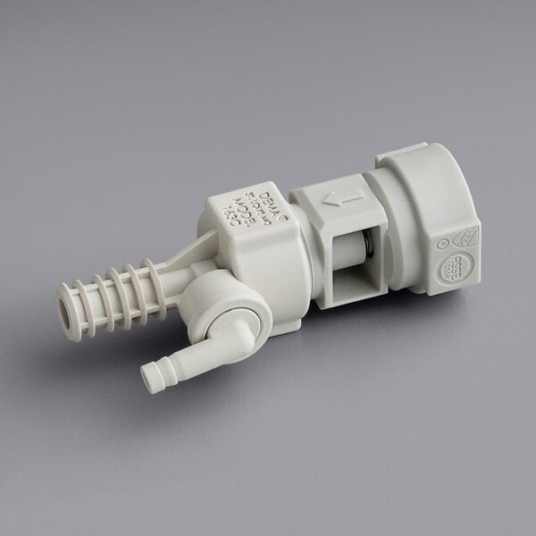 A close-up of a white plastic Dema Chemical Pump Proportioner.