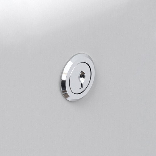 A close-up of a white Kimberly-Clark Professional ICON paper towel dispenser with a silver mosaic faceplate.