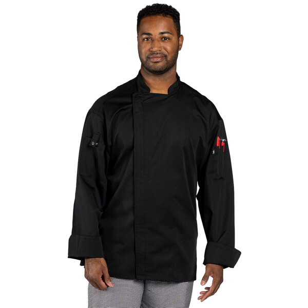 A man wearing an Uncommon Chef long sleeve black chef coat with a mesh back.