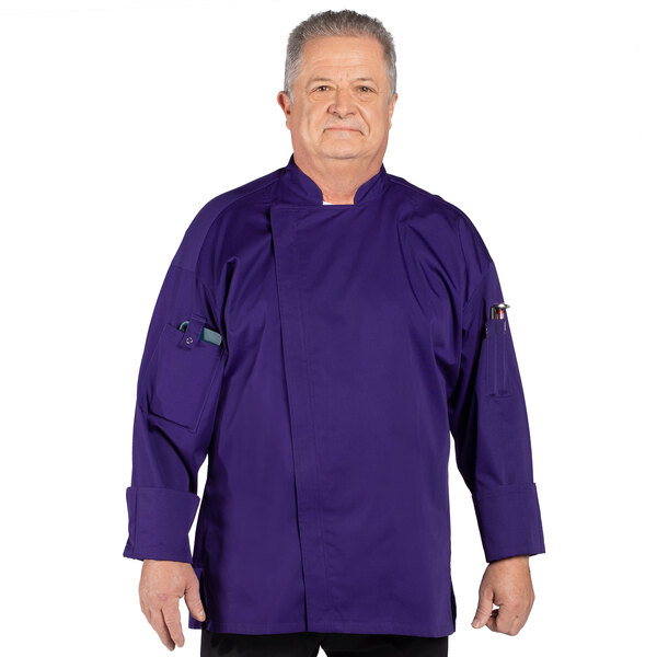 A man wearing a grape colored Uncommon Chef long sleeve chef coat.