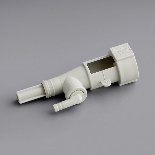 A white plastic device with a white plastic pipe and a square hole.