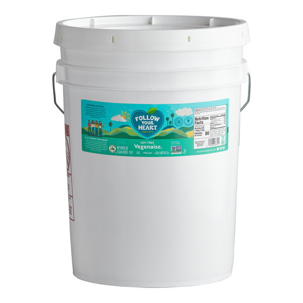 A 5-gallon white plastic pail of Follow Your Heart Vegenaise Soy-Free Vegan Mayonnaise.