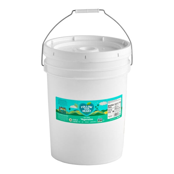 A 5-gallon white plastic pail of Follow Your Heart Soy-Free Vegenaise vegan mayonnaise.
