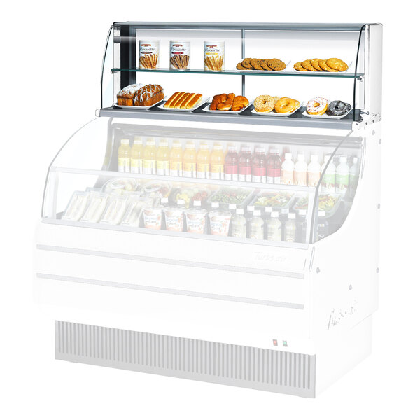 A white 63-inch top dry display case with shelves for displaying baked goods and snacks.