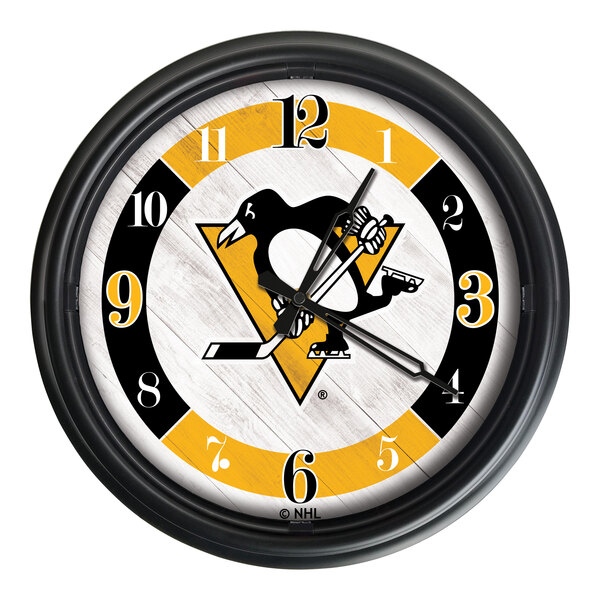 A Holland Bar Stool Pittsburgh Penguins wall clock with a penguin logo.