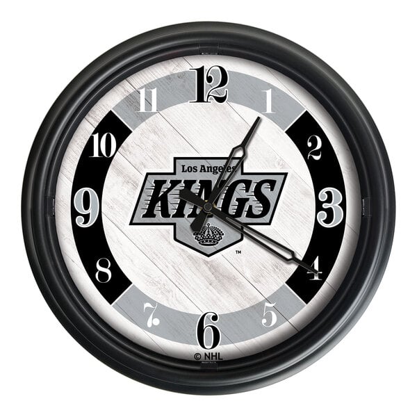 A round wall clock featuring the Los Angeles Kings logo and a black frame.