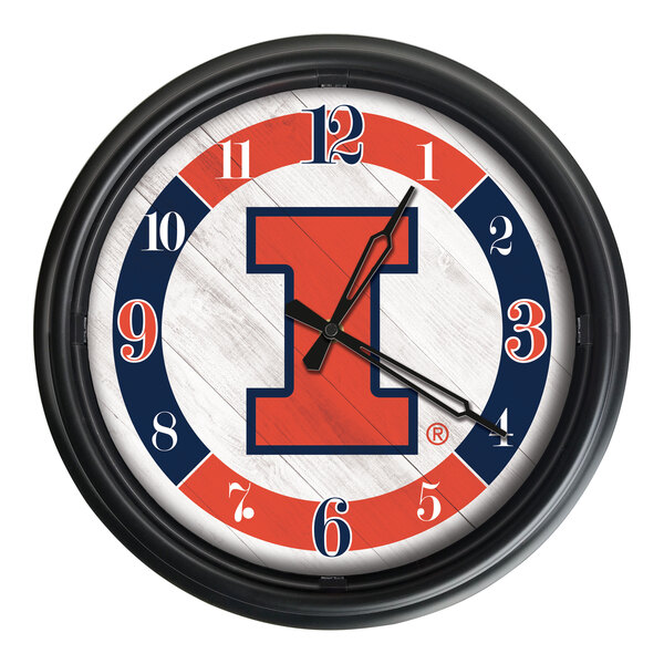 A round wall clock featuring the University of Illinois logo with orange and blue accents and a black frame.