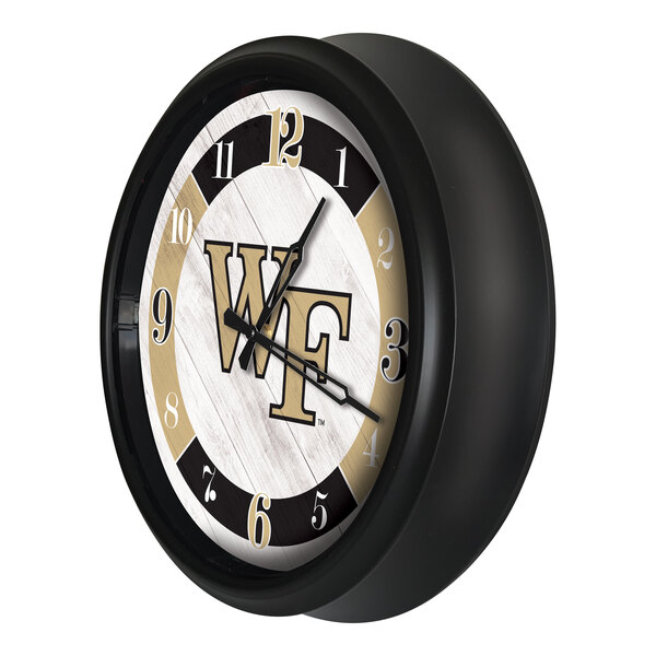 A round black wall clock featuring the Wake Forest University logo and LED lighting.